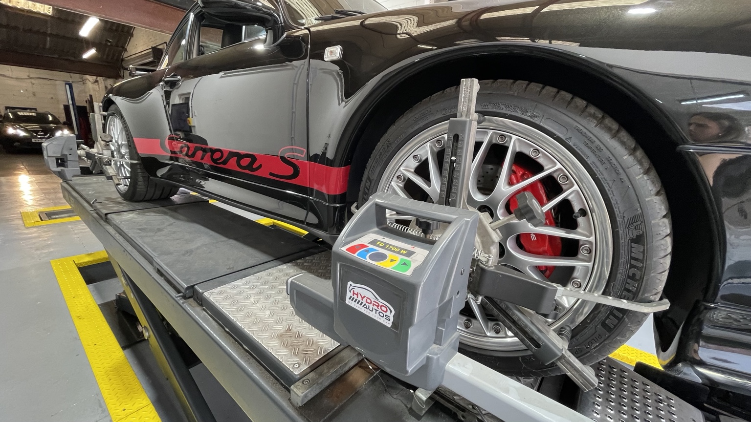 Wheel-alignment equipment fitted to a Porsche Carrera S
